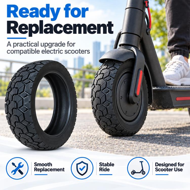 Black tubeless scooter replacement tire with deep tread on the front wheel