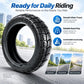 Black off-road vacuum scooter tire with deep tread on wheel rim