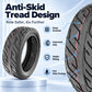 Black scooter tire with deep grooves and anti-skid tread pattern