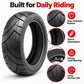 Black scooter tire with tread detail and round hub mounting face