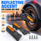 Black rear fork side covers with amber reflective inserts for improved visibility
