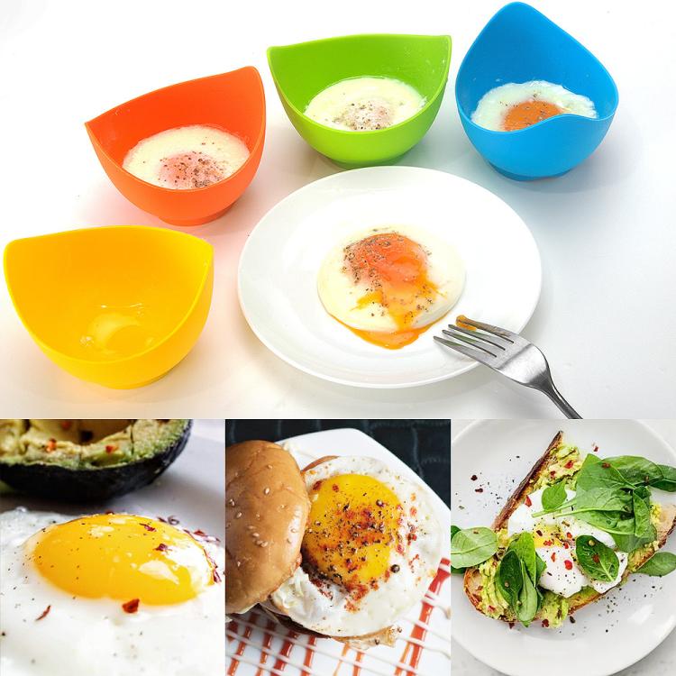 Colorful silicone egg poacher cups with poached eggs on a plate