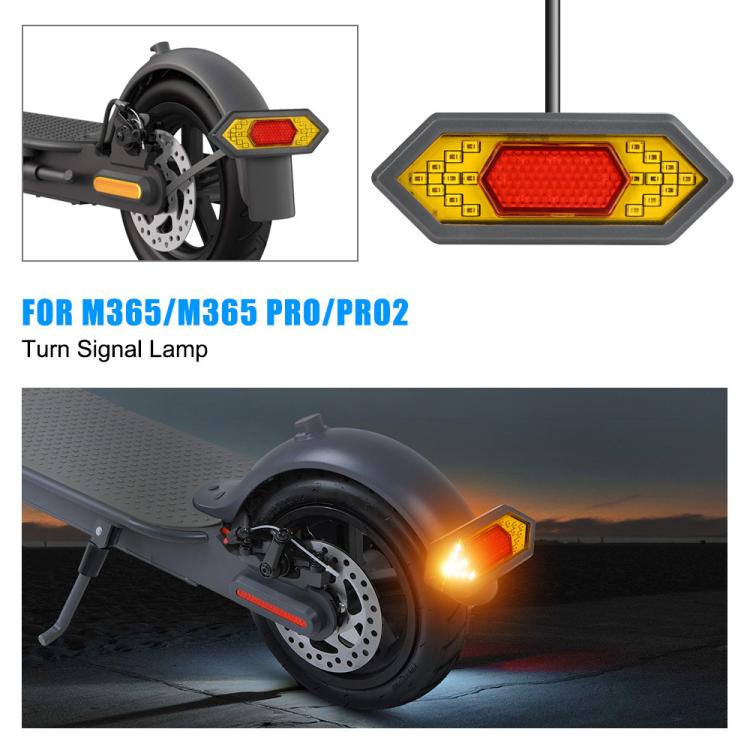 Rear turn signal lamp with red LED glow and yellow frame mounted on scooter fender