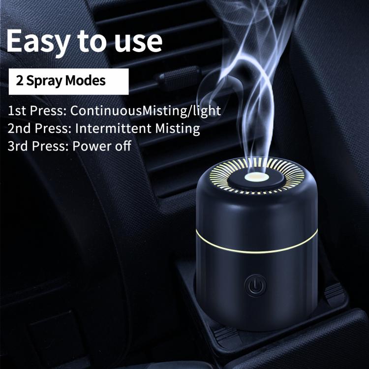Black car humidifier and air freshener with glowing top ring and power button