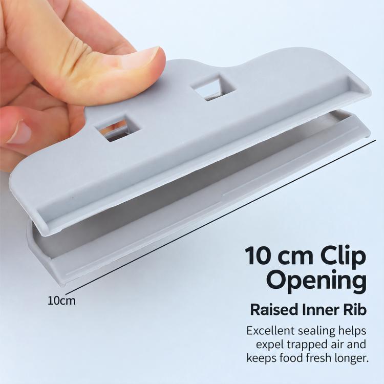 Light grey plastic food sealing clip with raised inner rib detail