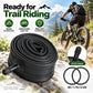 Black bicycle inner tube coil with AV32 valve stem, shown near a wheel