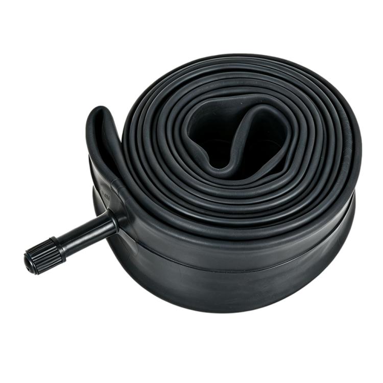 Black bicycle inner tube coiled with attached valve stem