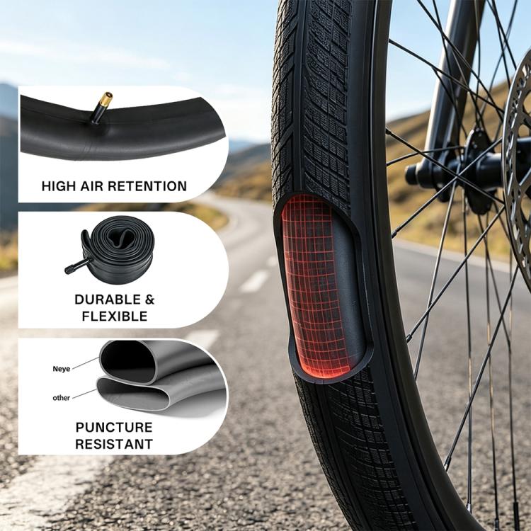 Black bicycle inner tube next to tire tread, valve stem visible