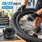 Black bicycle inner tube coil with valve stem on table