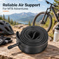Black bicycle inner tube coil with valve stem, resting on wooden surface