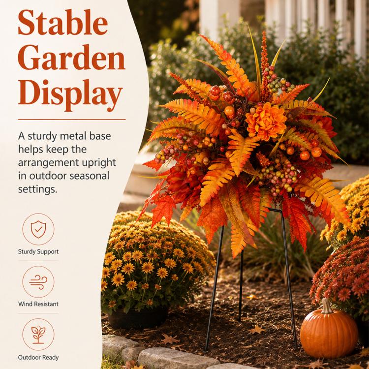Orange-red fall floral garden stake arrangement with fern leaves, berries, and three stakes