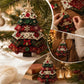 Layered fabric tree ornament with star top and button details, hanging from Christmas tree