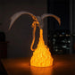 Black dragon night light with yellow flames, wings spread and flaming belly glow.
