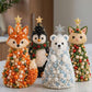 Beaded animal craft tree decorations standing side by side with gold star toppers