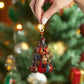 Guitar ornament hanging by gold chain, showing colorful electric guitars and star