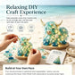 Sea glass Highland cattle DIY craft kit with hands placing glass pieces on base