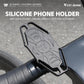 Black silicone bike phone holder with raised anti-slip grip pads on handlebar