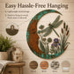 Moon-shaped wall decoration with dragonfly, reeds, and purple flowers in teal frame