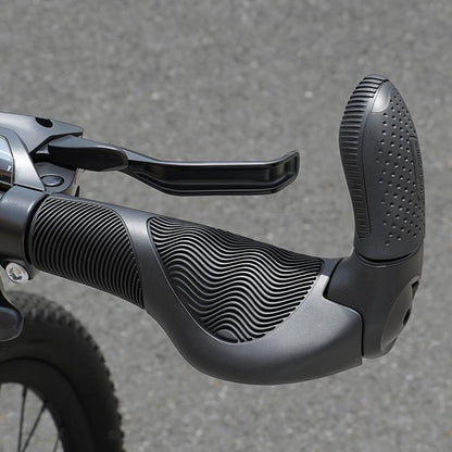 Black mountain bike handlebar grips with wavy texture and bar end