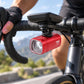 Red bike headlight with front mount bracket and clear LED lens on handlebar