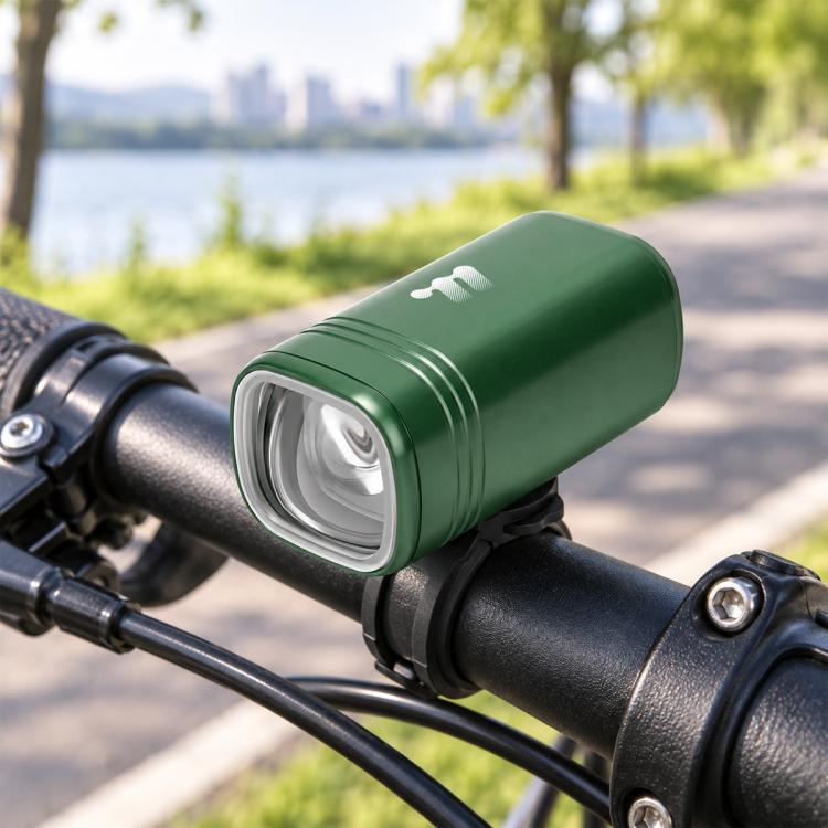 Green bike headlight cylinder with clear front LED lens on handlebar mount