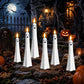 Ghost-shaped LED flameless candles, white plastic with various black face styles and lit tips (set).