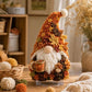 3D fabric poke gnome in autumn orange and brown with white beard, on stand