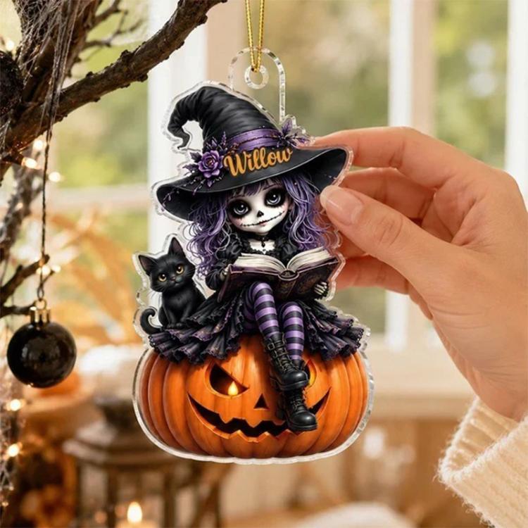 Hand holding Willow Halloween witch acrylic hanging ornament with jack-o-lantern and cat