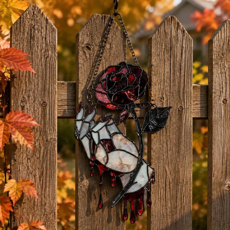 Hanging thorny rose sun catcher ornament with skull rose motif in black and red