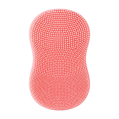 Pink silicone face cleansing brush with dense domed bristle tips on oval pad