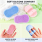 Blue and pink silicone face cleansing brushes with finger-grip back and domed bristles