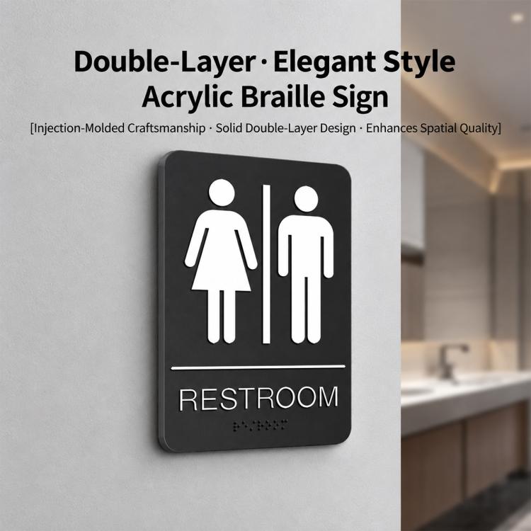 Black restroom Braille sign with raised male and female icons and RESTROOM label.