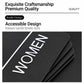 Black Braille sign close-up with raised dots and tactile WOMEN-style icon text.