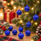 Blue painted small round bell charms, 14mm, hanging ornaments and loose charms on a table