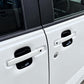 Black door handle cup trim covers installed on exterior door handles