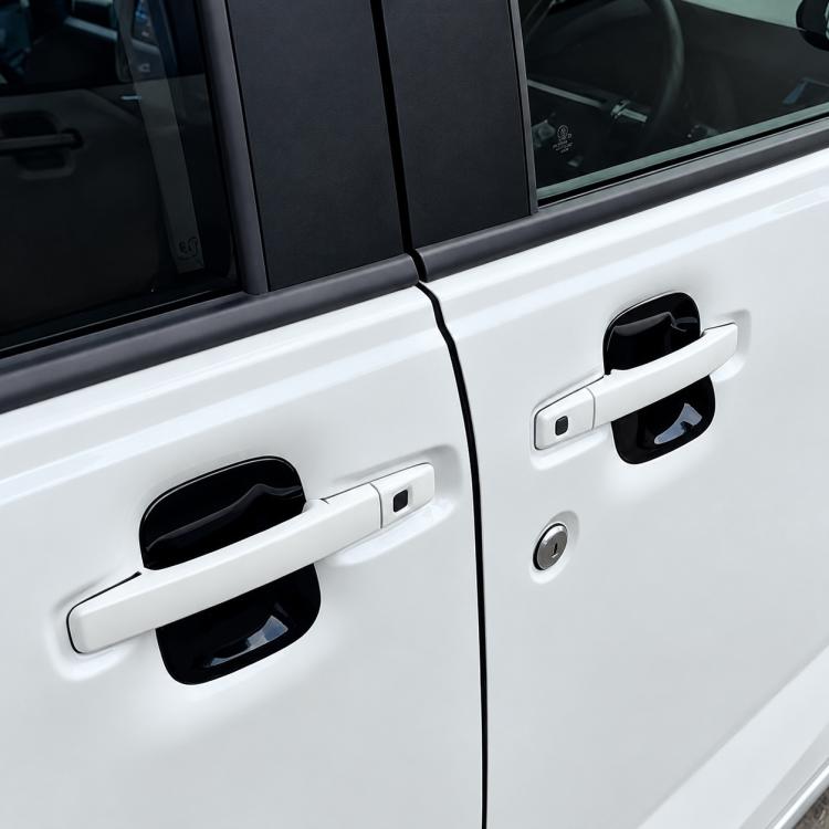 Black door handle cup trim covers installed on exterior door handles