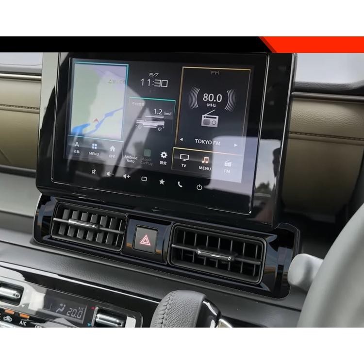 Center console air vent trim sticker, glossy black accent across dashboard vents
