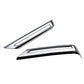 Two chrome rear bumper fog light trim bezels with long rectangular frames