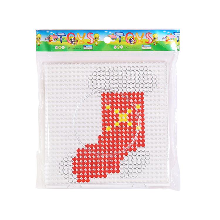 Christmas fuse bead craft template featuring a red crescent moon and white beads