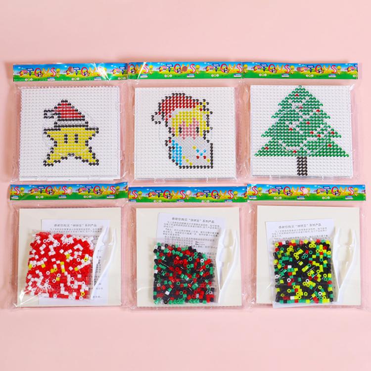 Christmas fuse bead craft set with pegboard templates and bead packets, including tree and figure