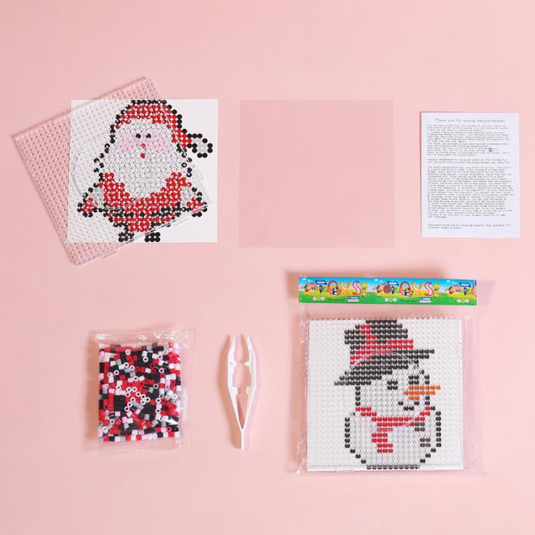 Christmas fuse bead craft set with snowman and Santa templates, pegboards, and bead packets