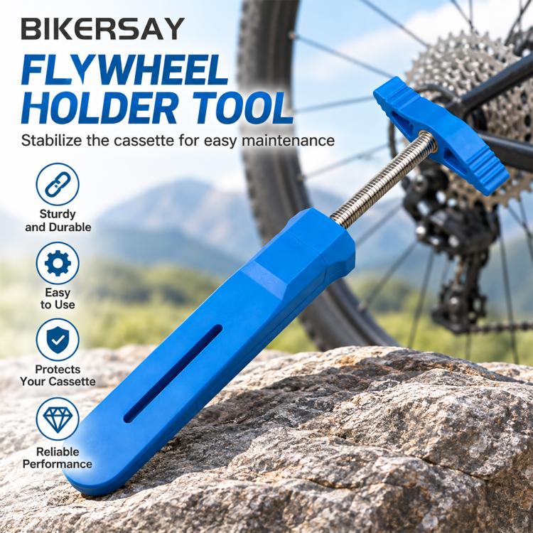 Blue piston reset tool with threaded rod and wide base resting near a bike cassette