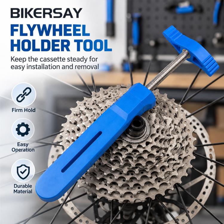 Blue brake piston reset tool clamped against a bike cassette with threaded rod and handle