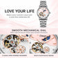 Two-tone automatic mechanical watch with light dial and moon-and-stars motif