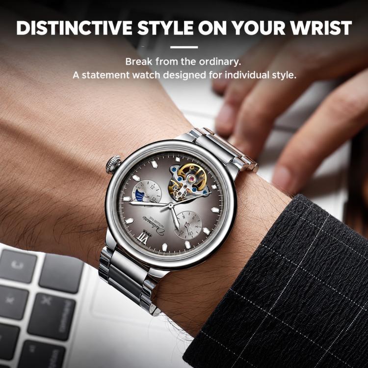 Men's automatic mechanical watch with taupe dial and silver steel bracelet on wrist