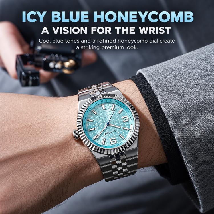 Men’s mechanical watch on wrist with icy blue honeycomb dial and dark metal link band