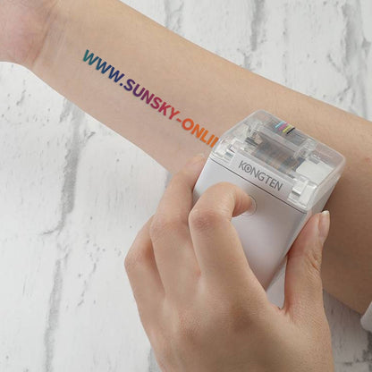 White mini portable color printer held in hand with clear top window