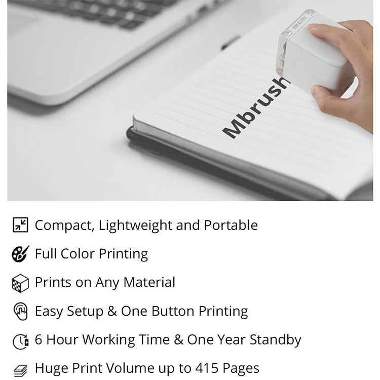 White mini portable color printer held over a notebook page