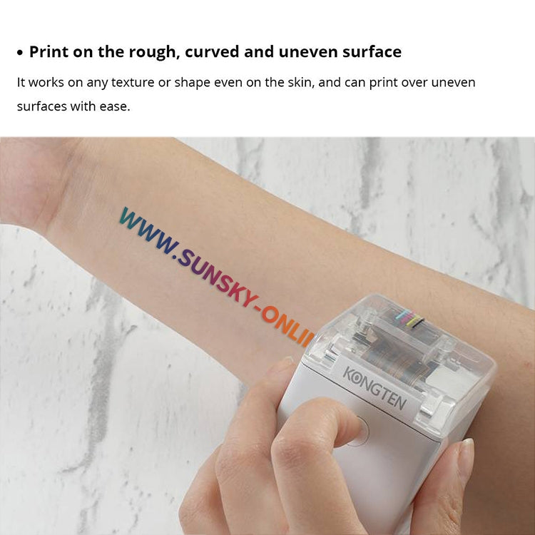 White mini portable color printer held near skin with clear cartridge window