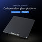 Heated glass build plate, dark surface with CREALITY logo and corner warning icon